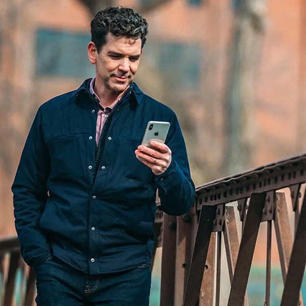 image of man looking at mobile phone