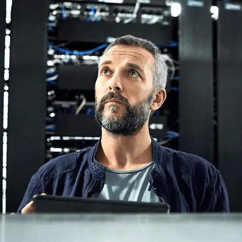 man with beard looking at server