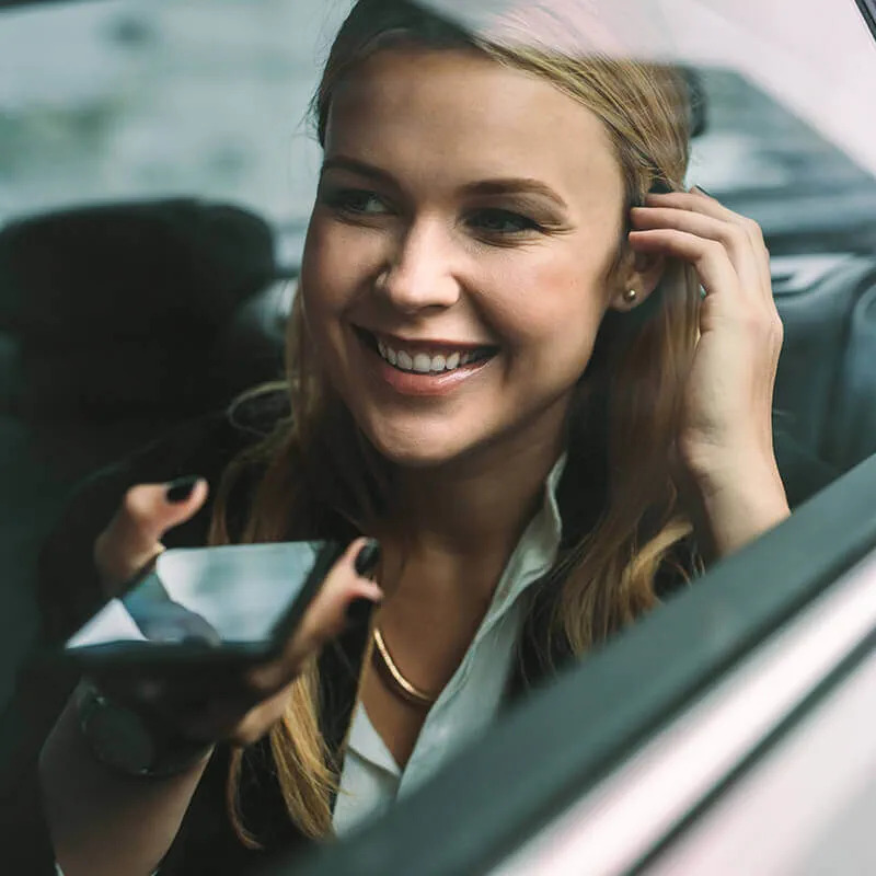 woman on phone in car