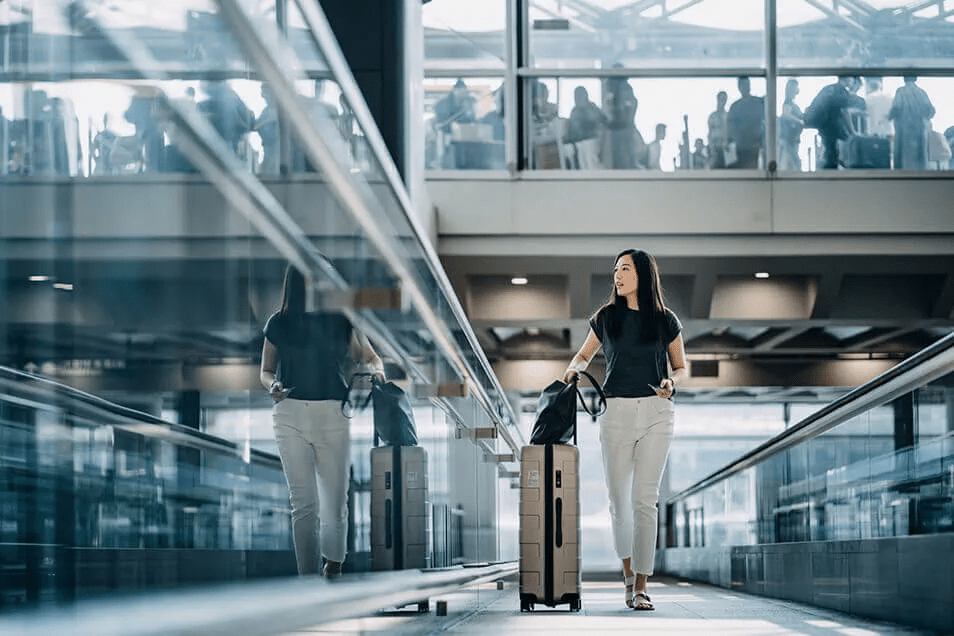 woman walking with luggage