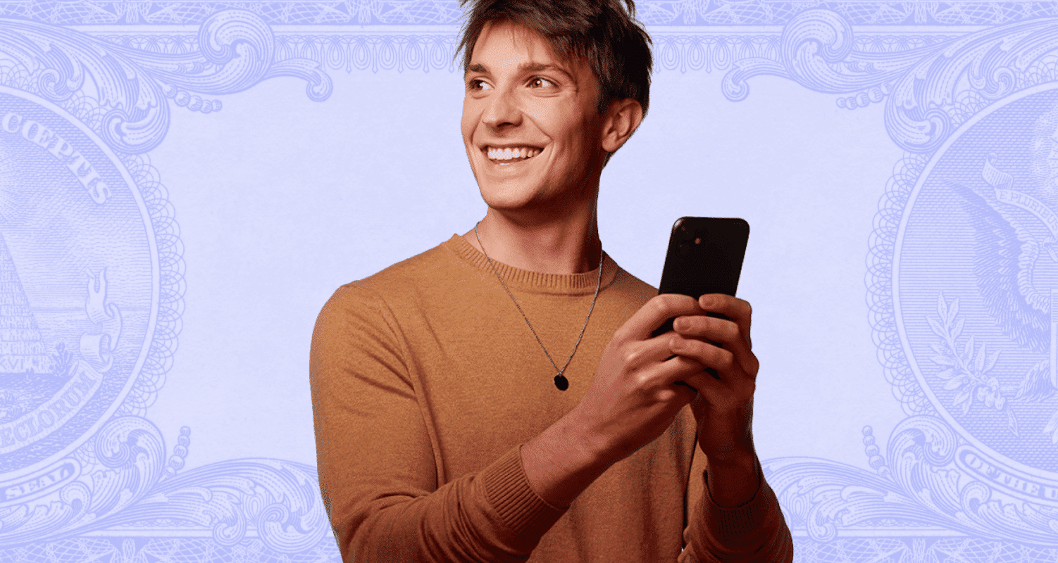 Man holding a phone and smiling