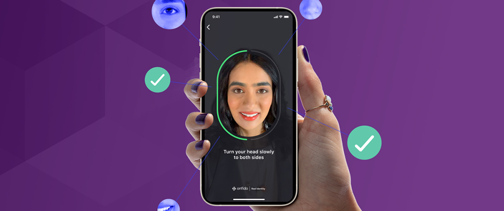 woman's hand holding mobile device while scanning her face