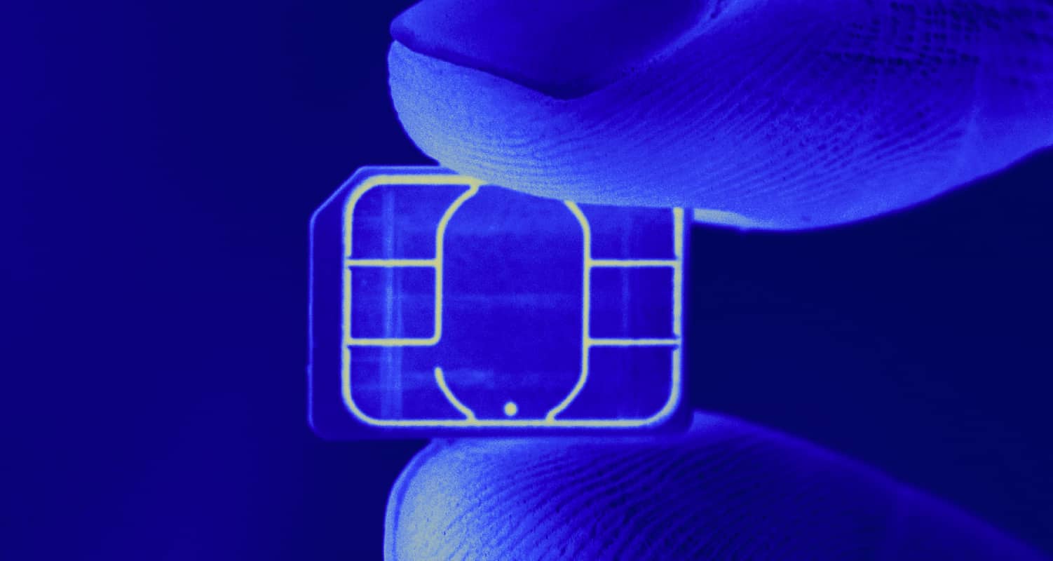 sim swap fraud small chip between two fingers