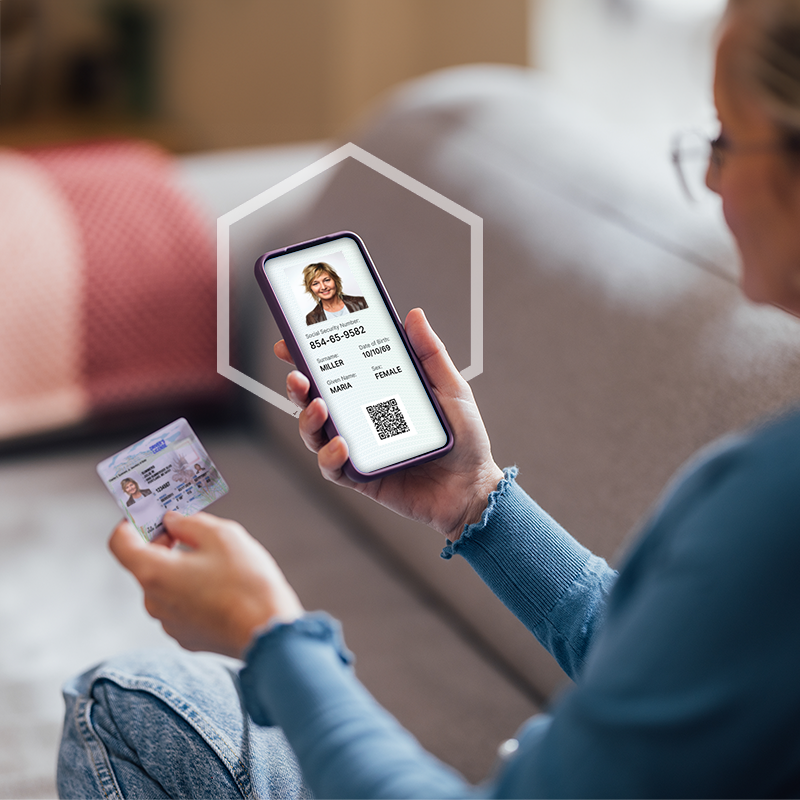 Woman holding a phone and ID