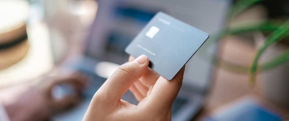 Person holding a financial card
