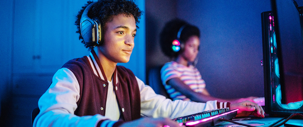 Two people playing video games on a computer