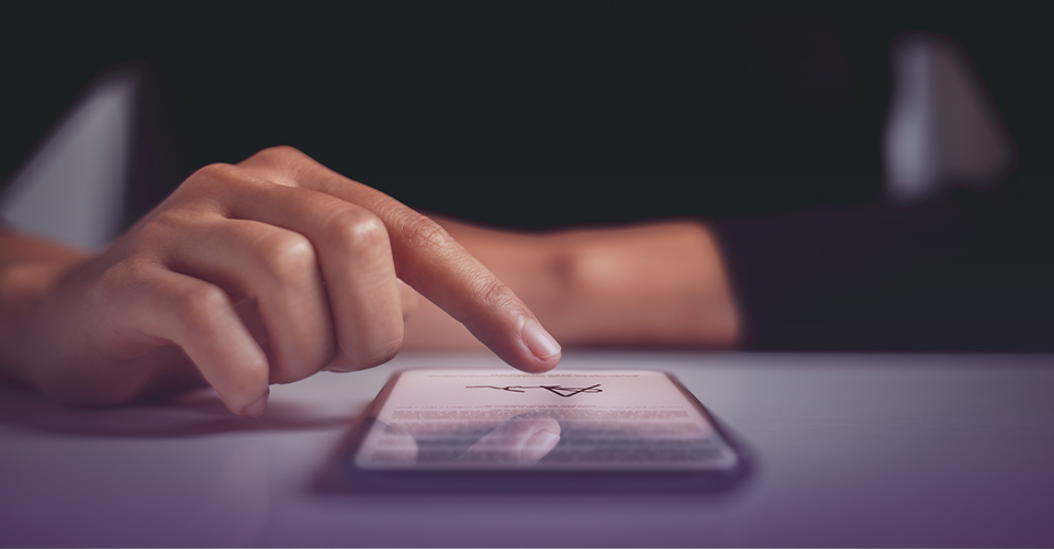 Finger tapping a smartphone screen to approve a digital document
