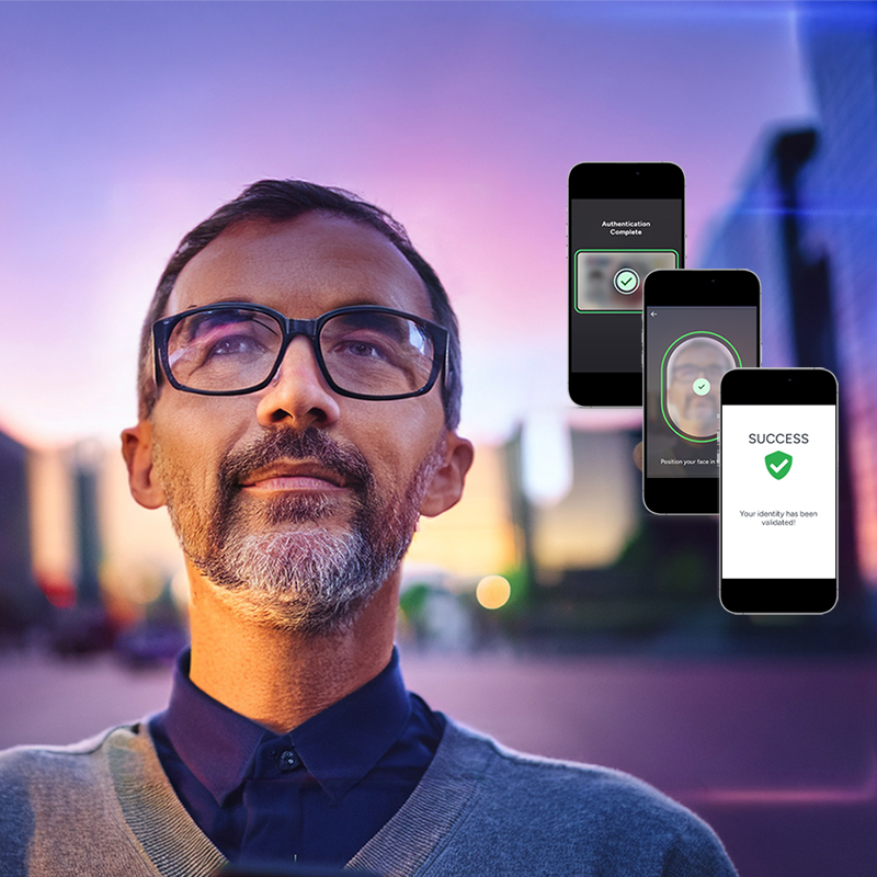 man in glasses looking towards sky with city background