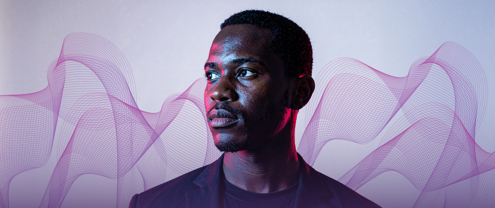 man gazing left with purple hue abstract background