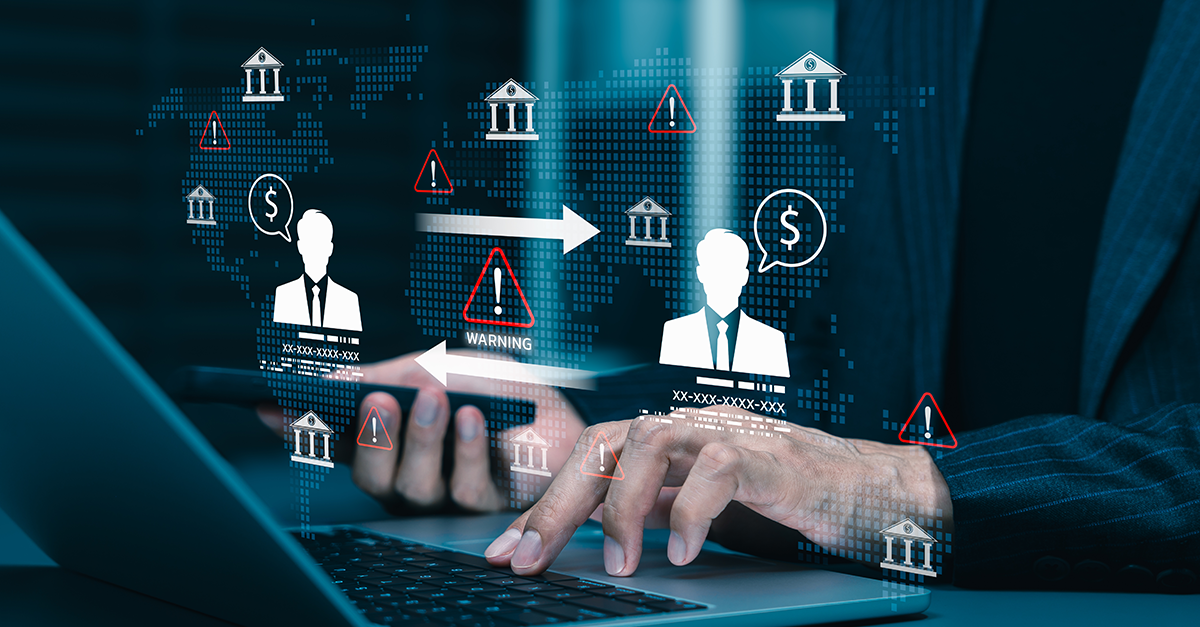 Business professional using a laptop with digital banking, money transfer, and fraud warning icons