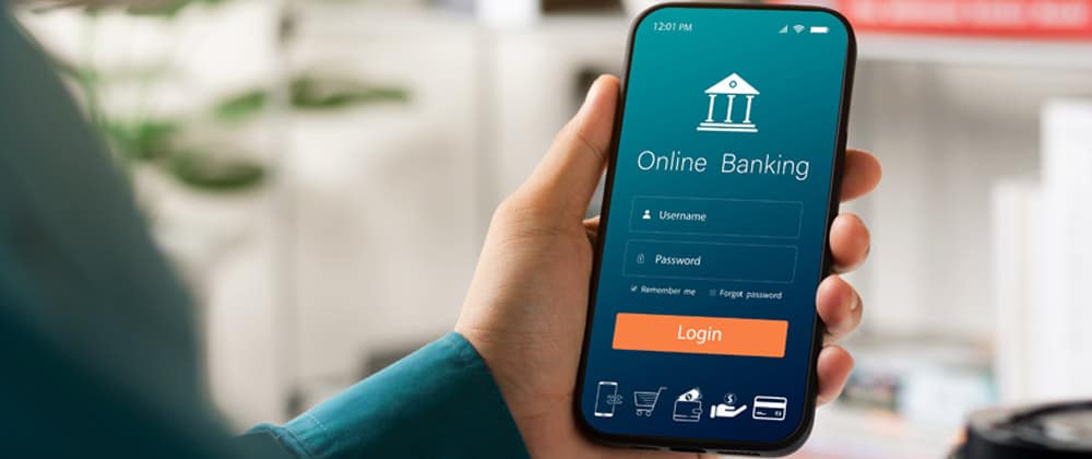 Male,Executive,Using,Smartphone,To,Conduct,Online,Mobile,Banking,,Investing