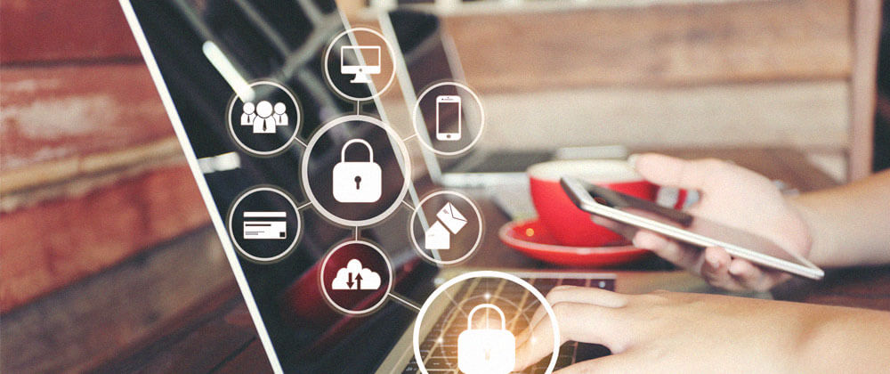 close up of person using authentication on mobile phone and laptop