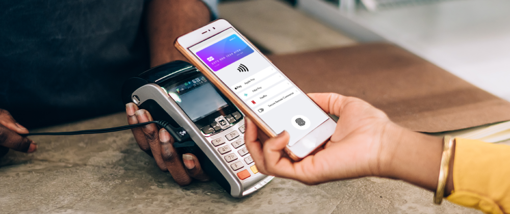 Person holding a phone with mobile wallet