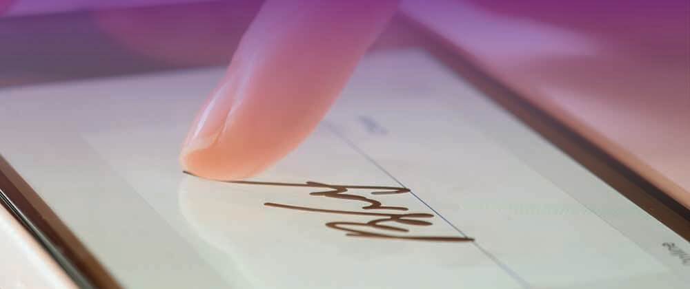 Finger signing a digital signature on a screen