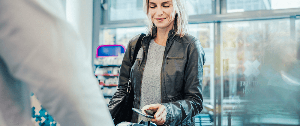 A woman scanning her phone