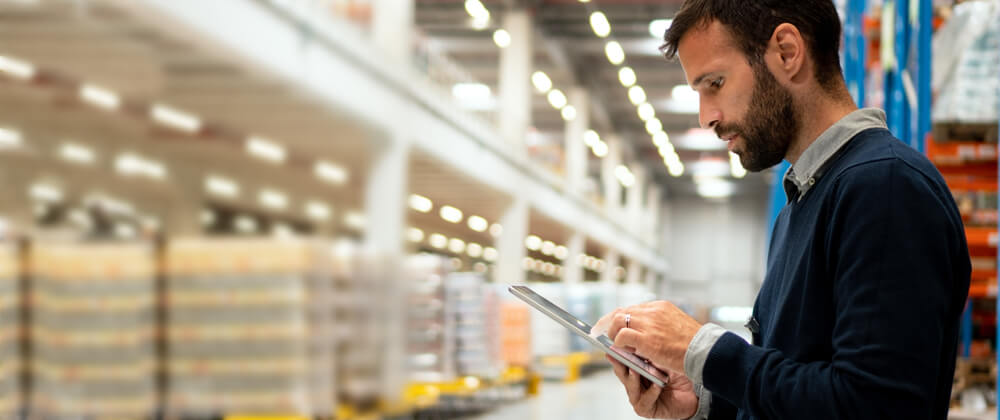 Man using a tablet in a warehouse
