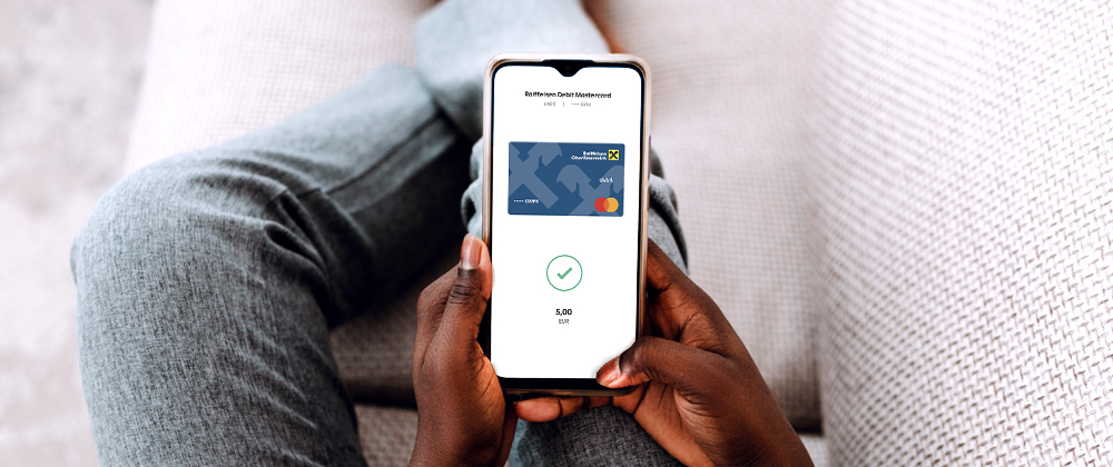 Person holding a phone with digital card