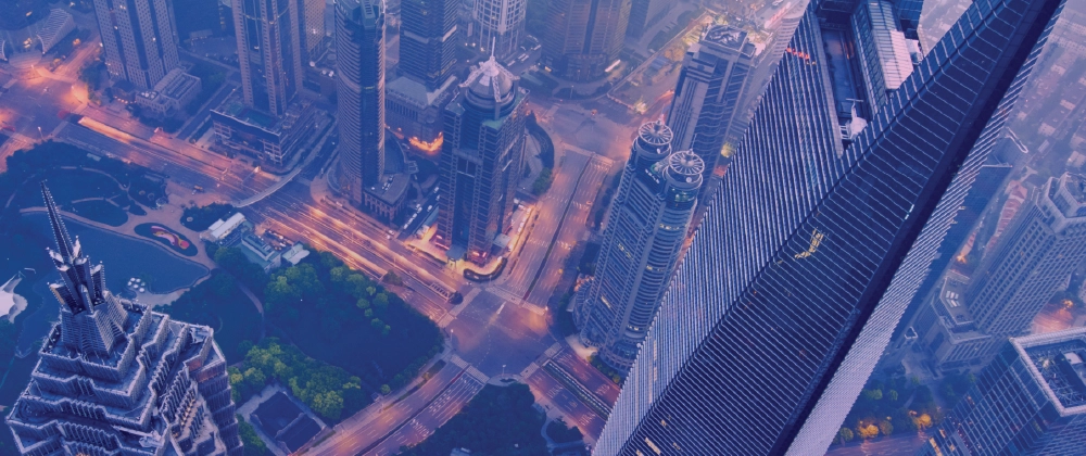 view of city streets below from tall building