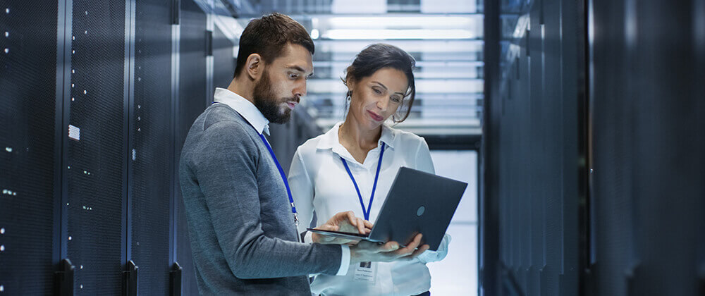 Man and woman looking at laptop