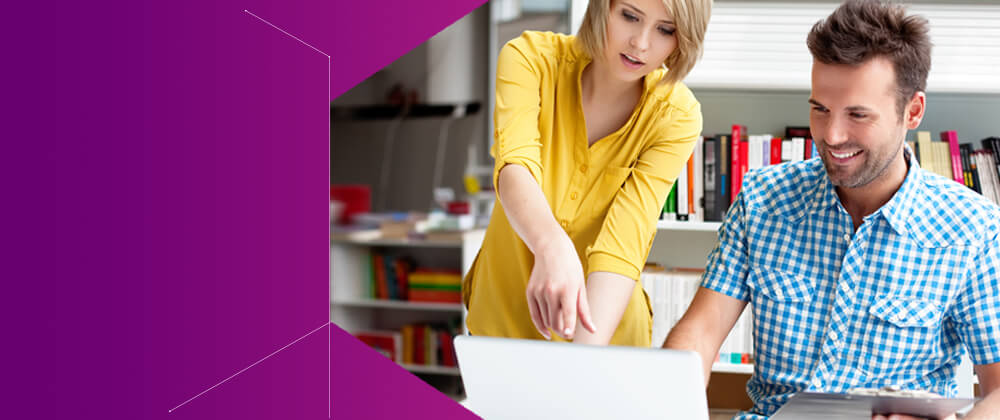 man and woman looking at laptop